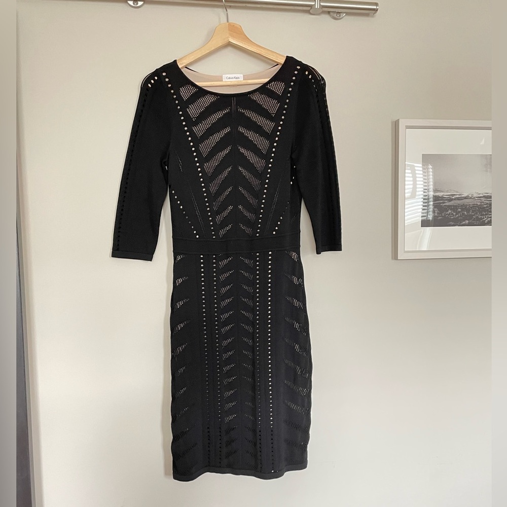 Form fitting, stretchy, black dress with cutout pattern by Calvin Klein